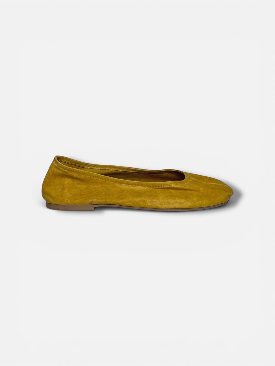 Leather ballet flats side profile soft feminine silhouette