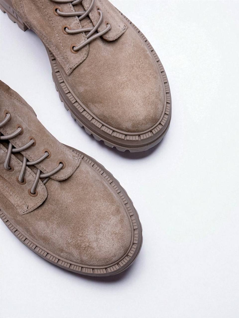 Leather boots upper detail fine stitching minimal