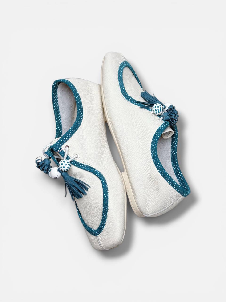 Artisan leather shoes front angle aqua accents design