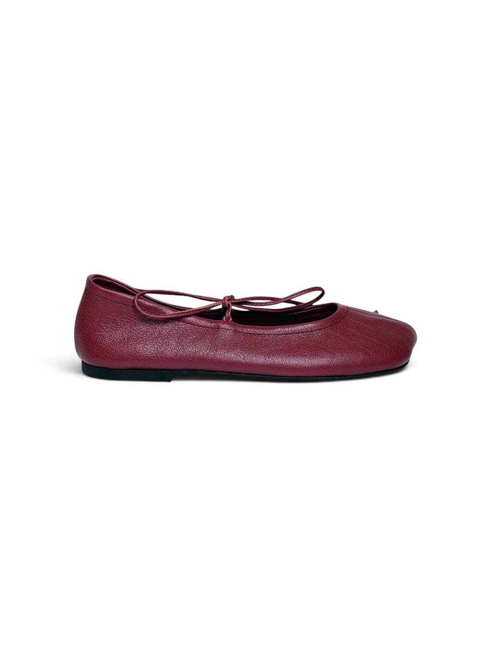 Side view of garnet leather ballet flat with low profile