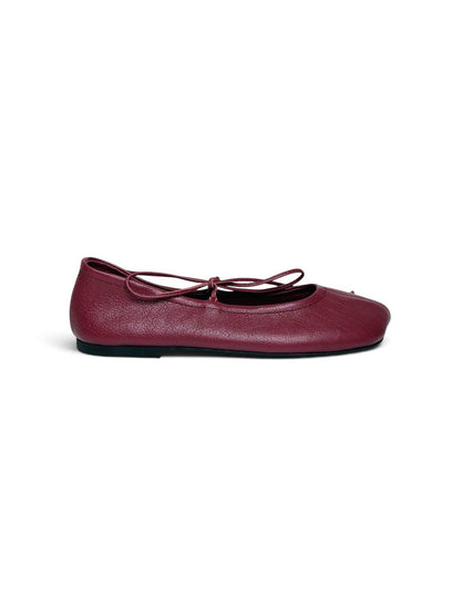Side view of garnet leather ballet flat with low profile