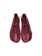Garnet ballet flats showing anatomical shape and leather tie detail