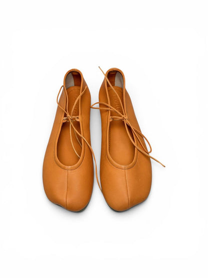 Handmade amber ballet flats top view