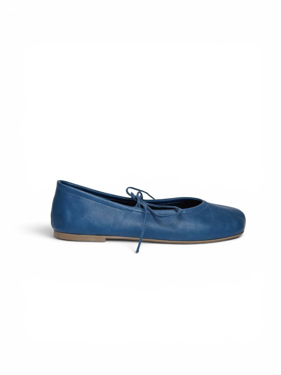Side profile blue leather ballet flats