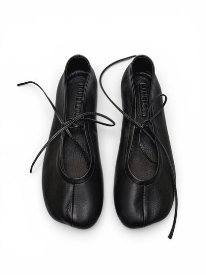 Minimalist dark blue ballet flats with lace detail