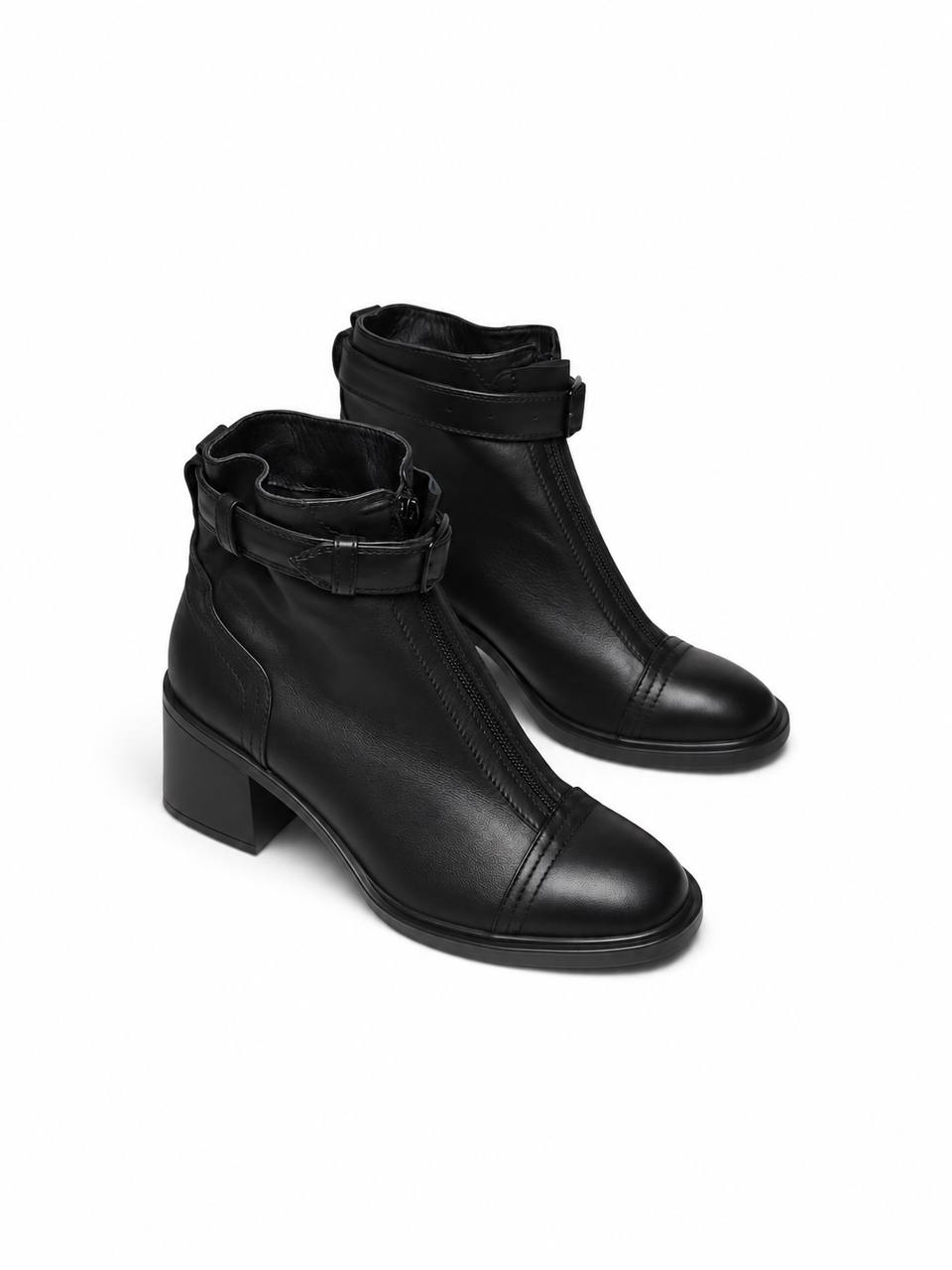 Black leather ankle boots with front zippers and buckle straps by HAMELEON