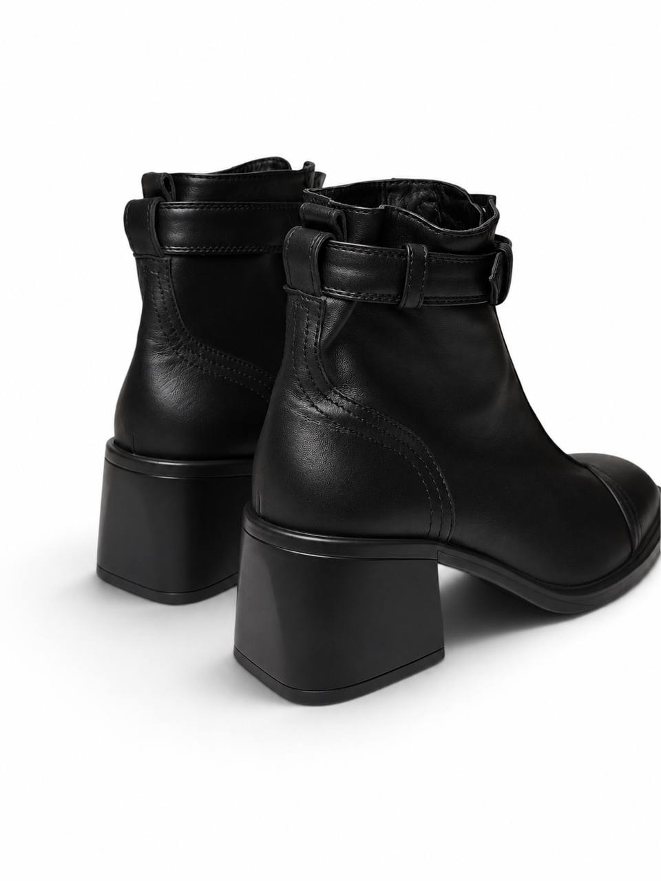 Black Rider ankle boots with front zippers and rounded toes