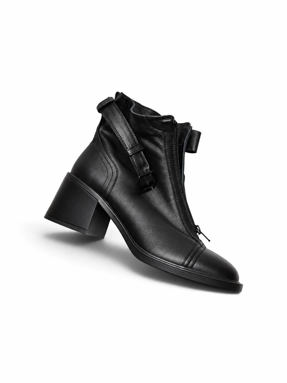 Side view of black leather boot Rider with zipper and heel
