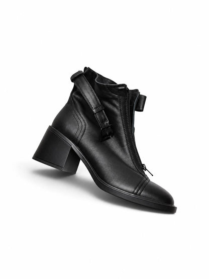 Side view of black leather boot Rider with zipper and heel