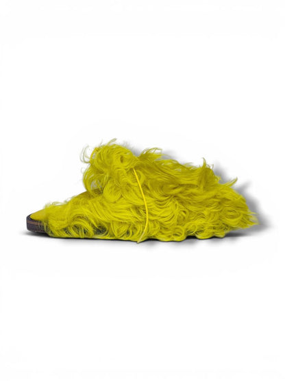 Bright yellow fur clogs side angle