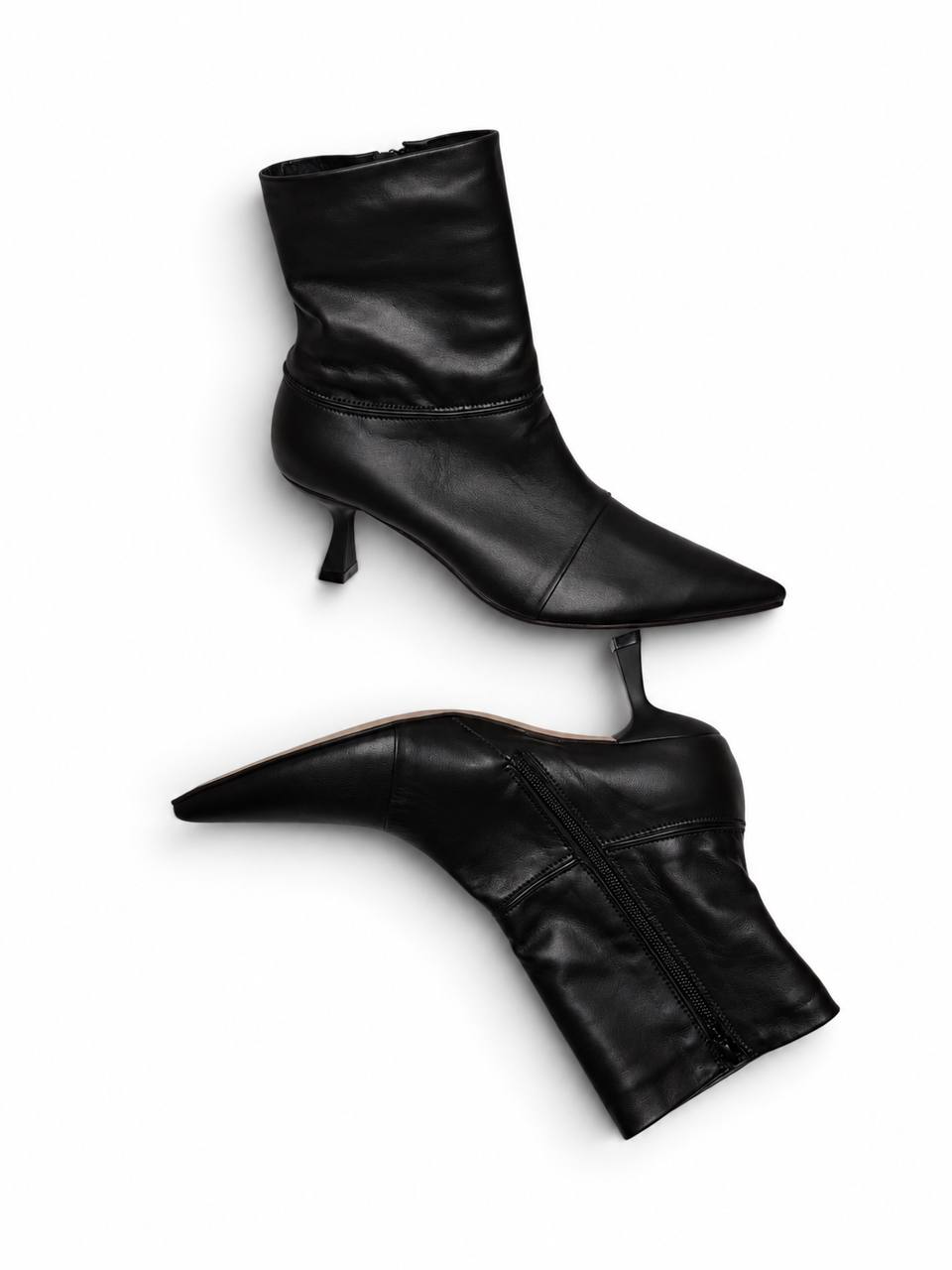 Black leather ankle boots Cindy showing the side zipper and heel