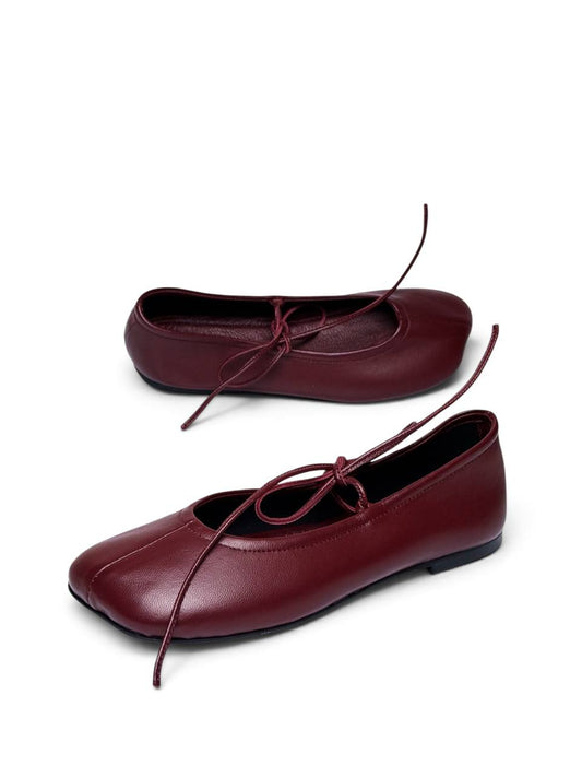 Claret ballet flats in burgundy leather shown from a side angle