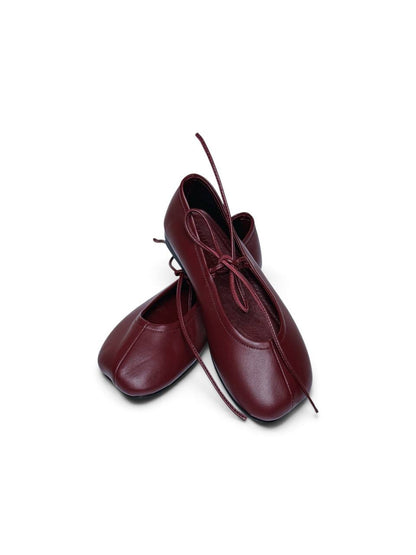 Claret leather ballet flats with rounded-square toes and lace ties