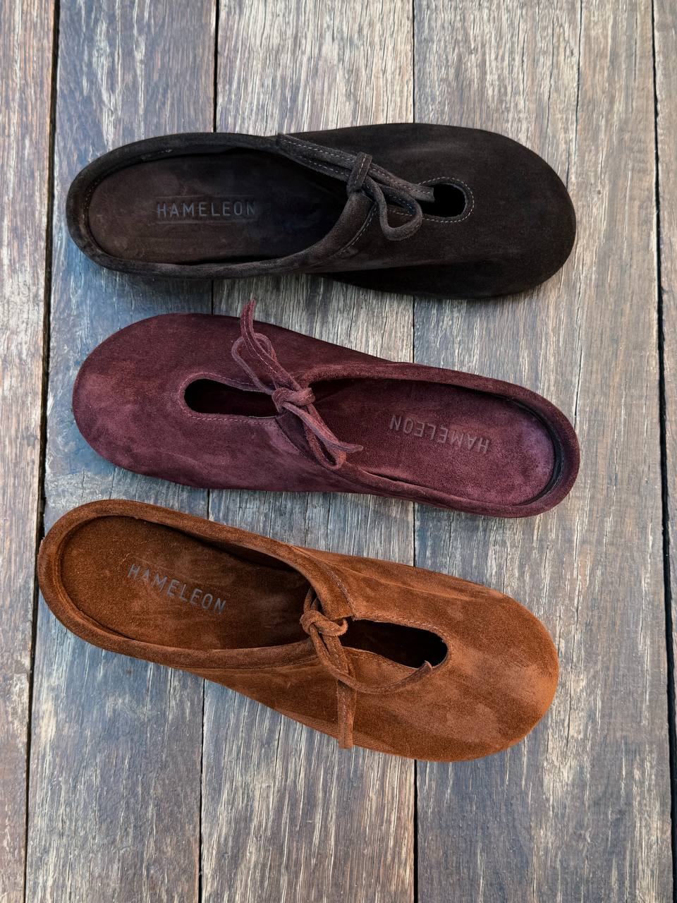 Autumn Collection of suede slipper flats Lulu on a wooden floor