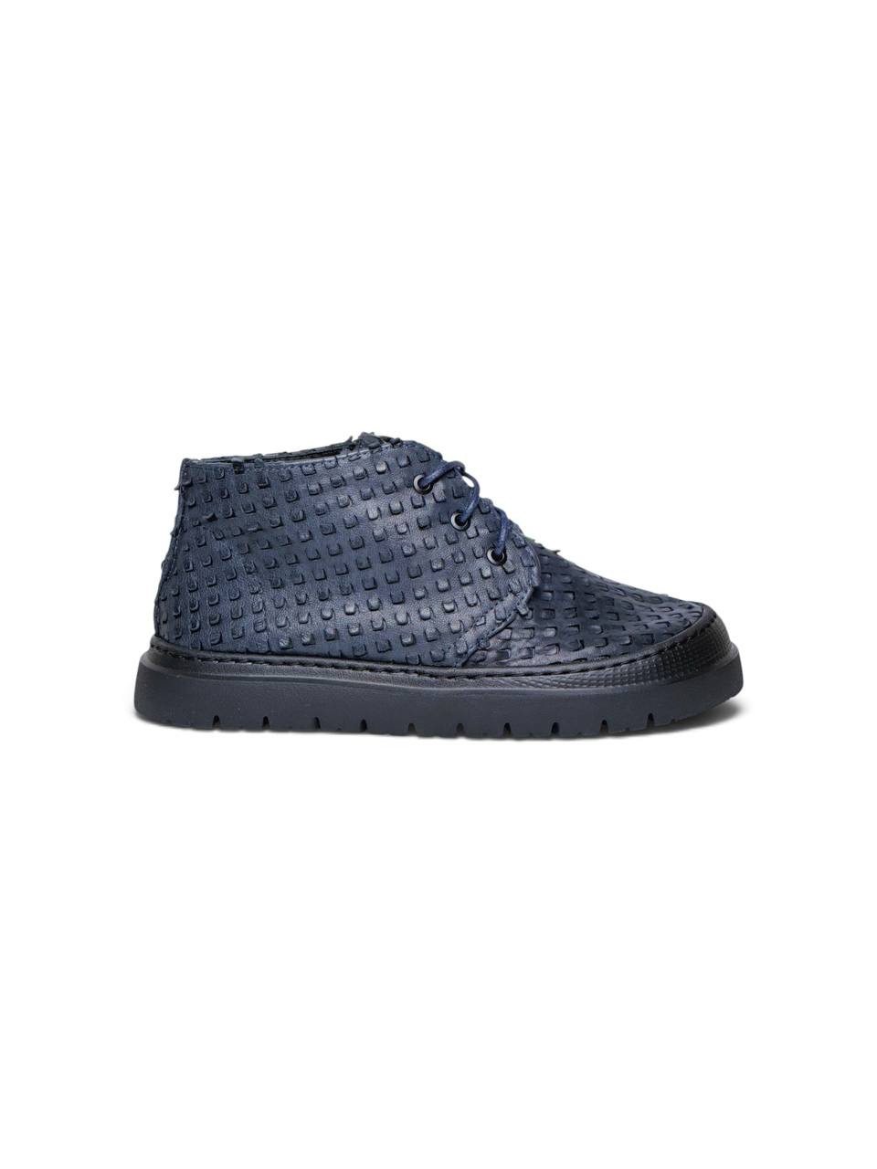 Side profile of navy desert boots with thick flexible EVA soles.