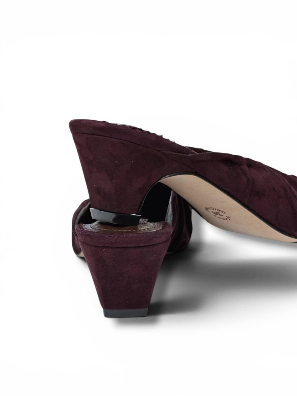 Handcrafted suede mule heels with softly draped texture