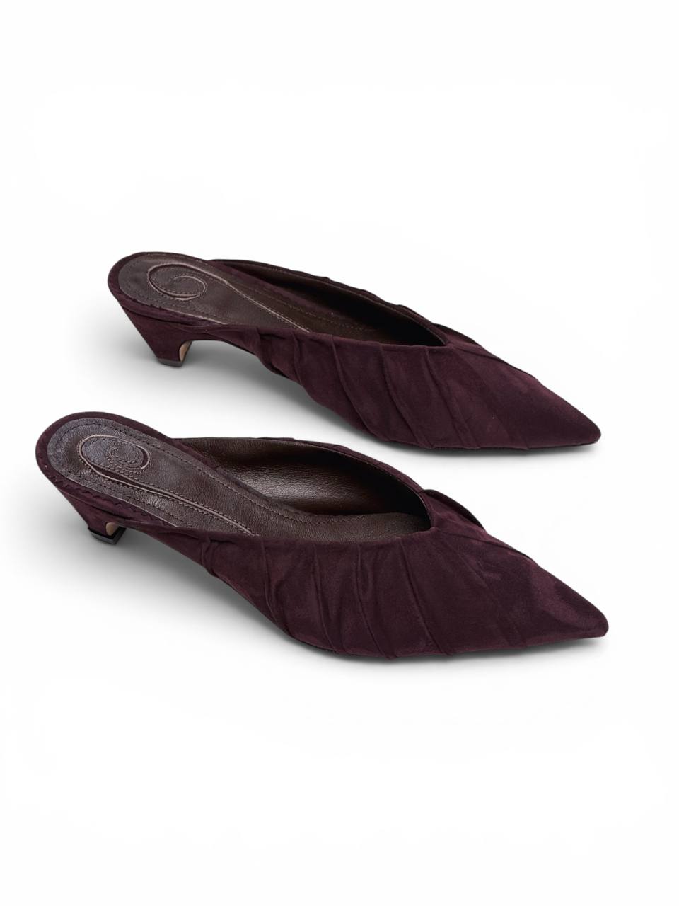 Burgundy suede mule heels with sculpted pointed silhouette
