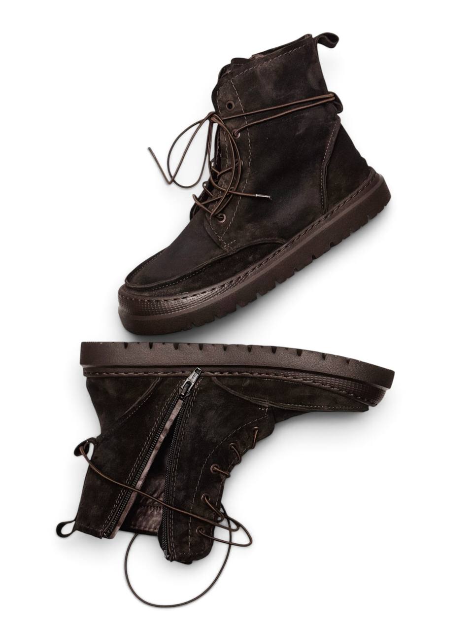 Pair of dark brown suede boots Dusk