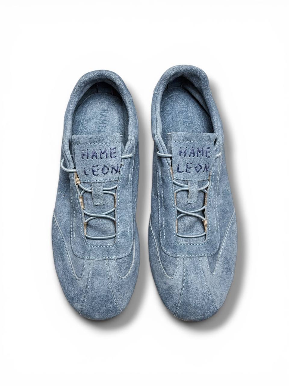 Blue suede sneakers top view clean lace system