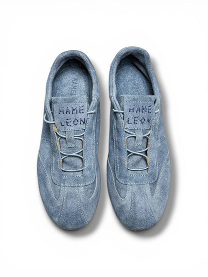 Blue suede sneakers top view clean lace system