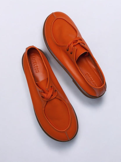 Burnt orange leather shoes front angle minimal
