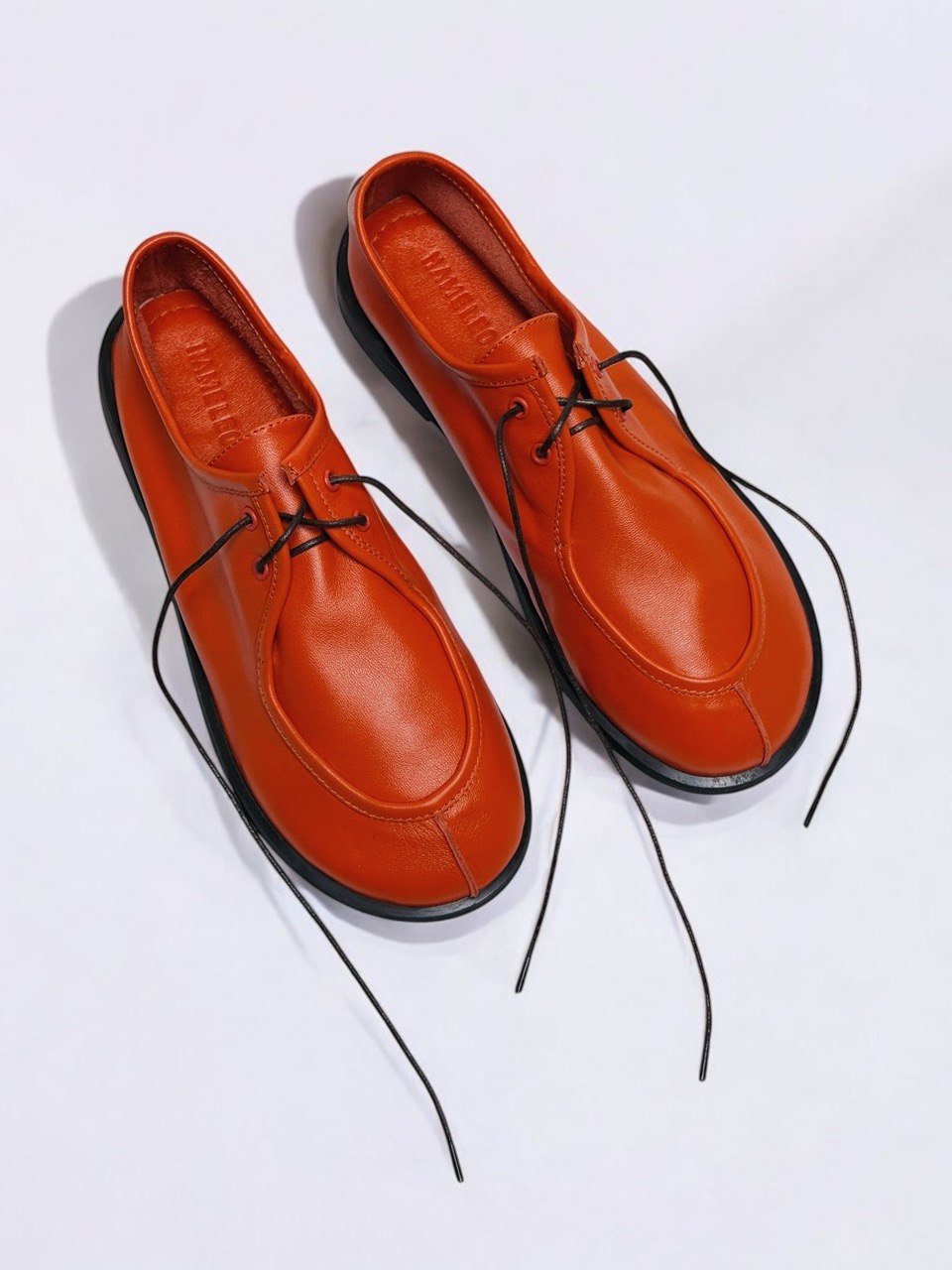 Orange leather walkers top view lace detail