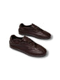 Sneakers Flow Espresso in dark brown leather, angled view