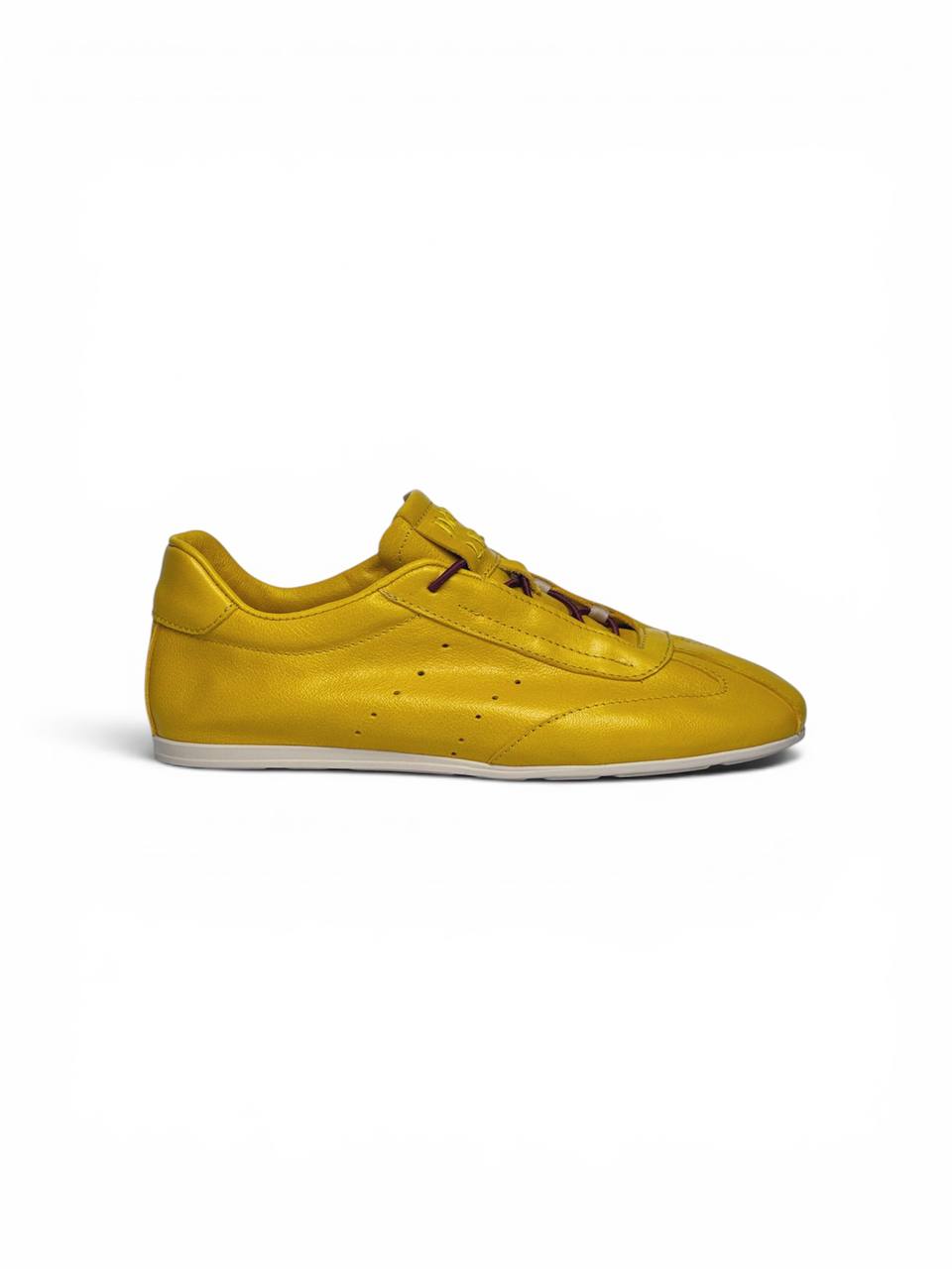 Clean silhouette of handmade saffron leather sneakers