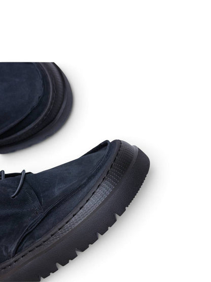 Textured EVA outsole and rounded suede toe detail