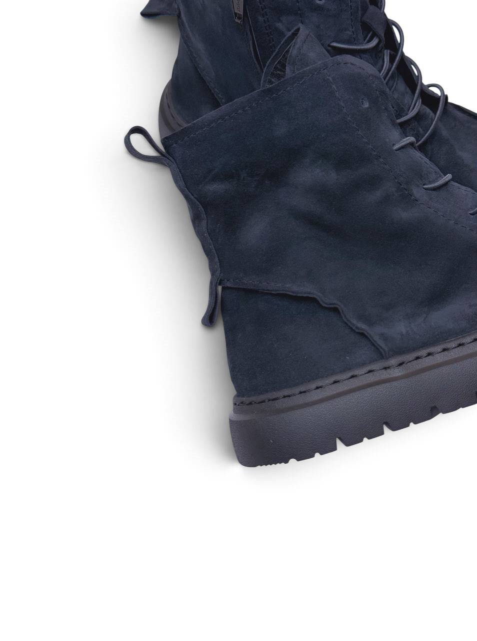 Rounded moc-toe construction in dark blue-black suede