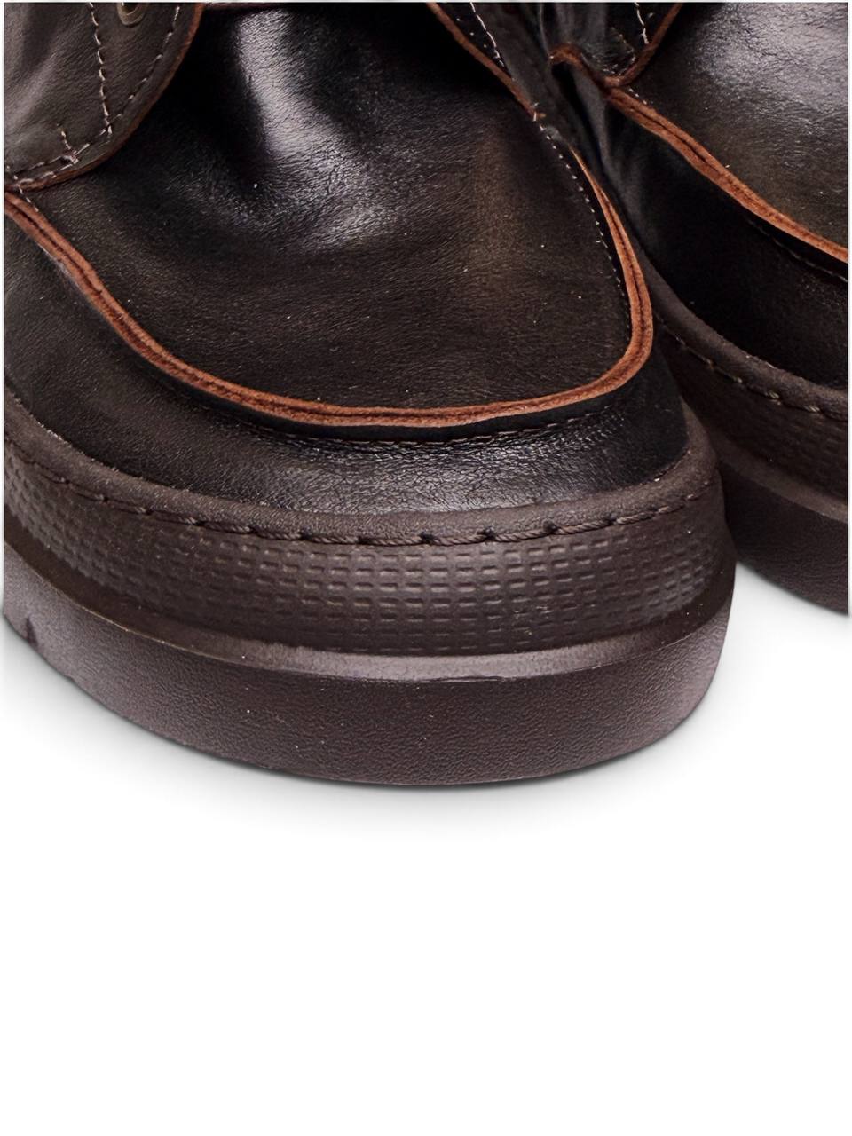 Close-up of Terra leather upper and exposed stitching details