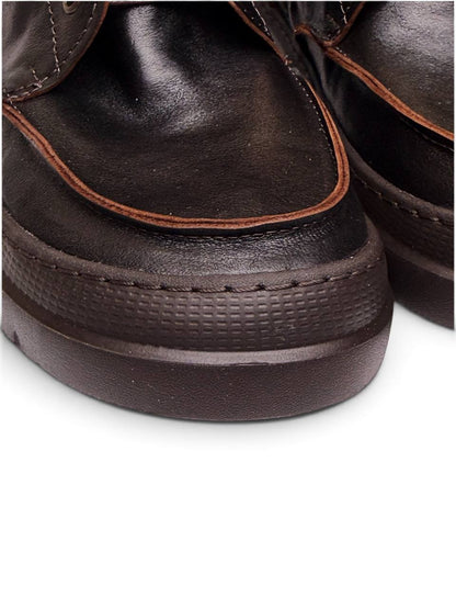 Close-up of Terra leather upper and exposed stitching details