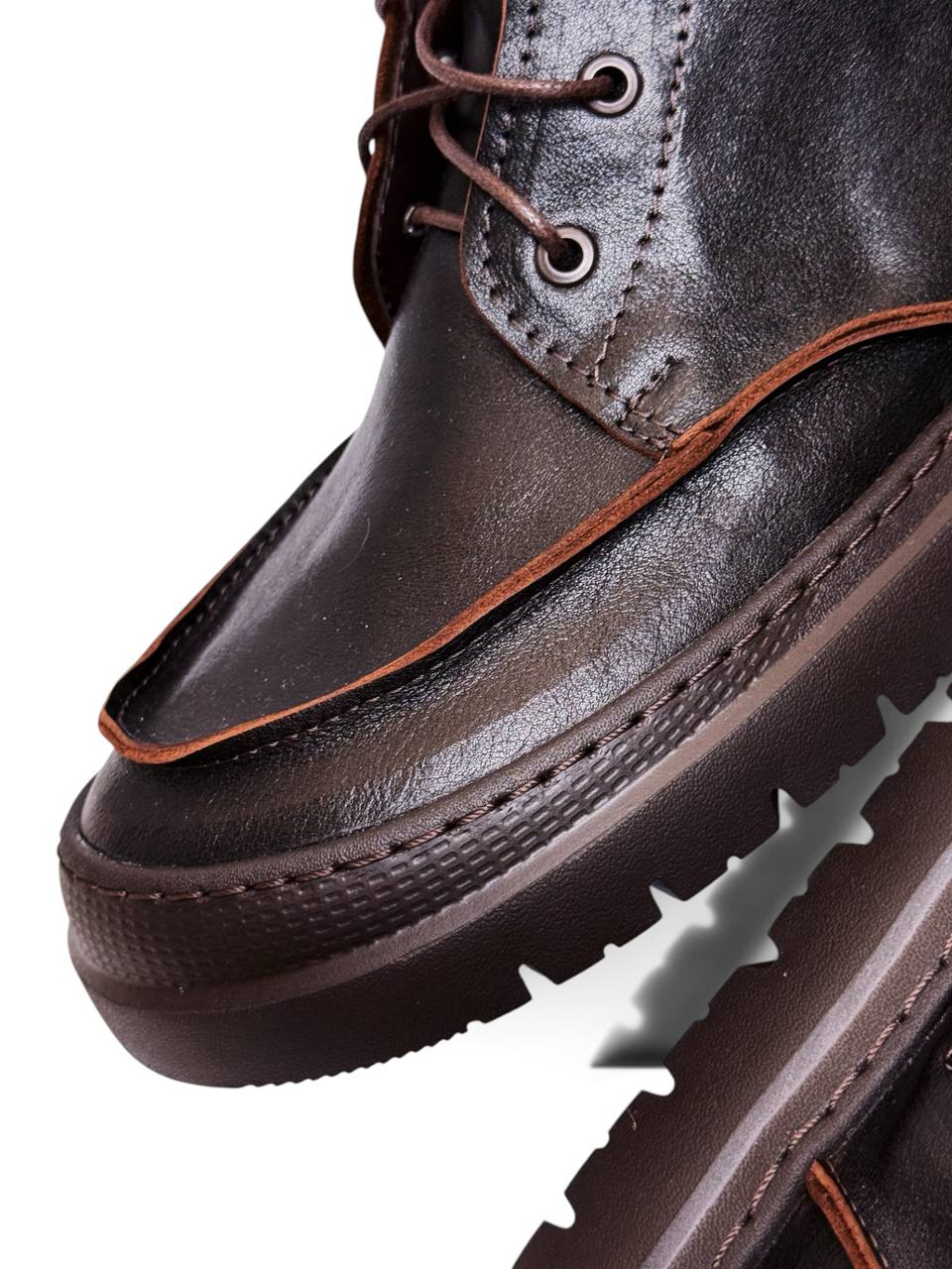Close-up of Terra leather boots showing moc-toe stitching