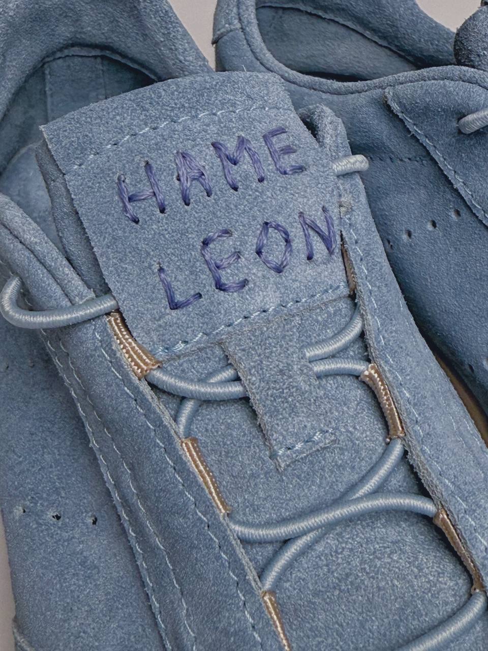 Elastic lace system on handmade suede sneakers