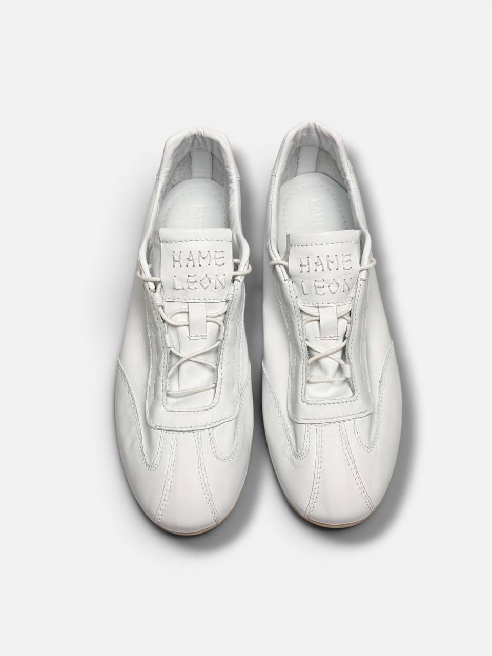 Editorial white leather sneakers Flow Pure contemporary minimalist style