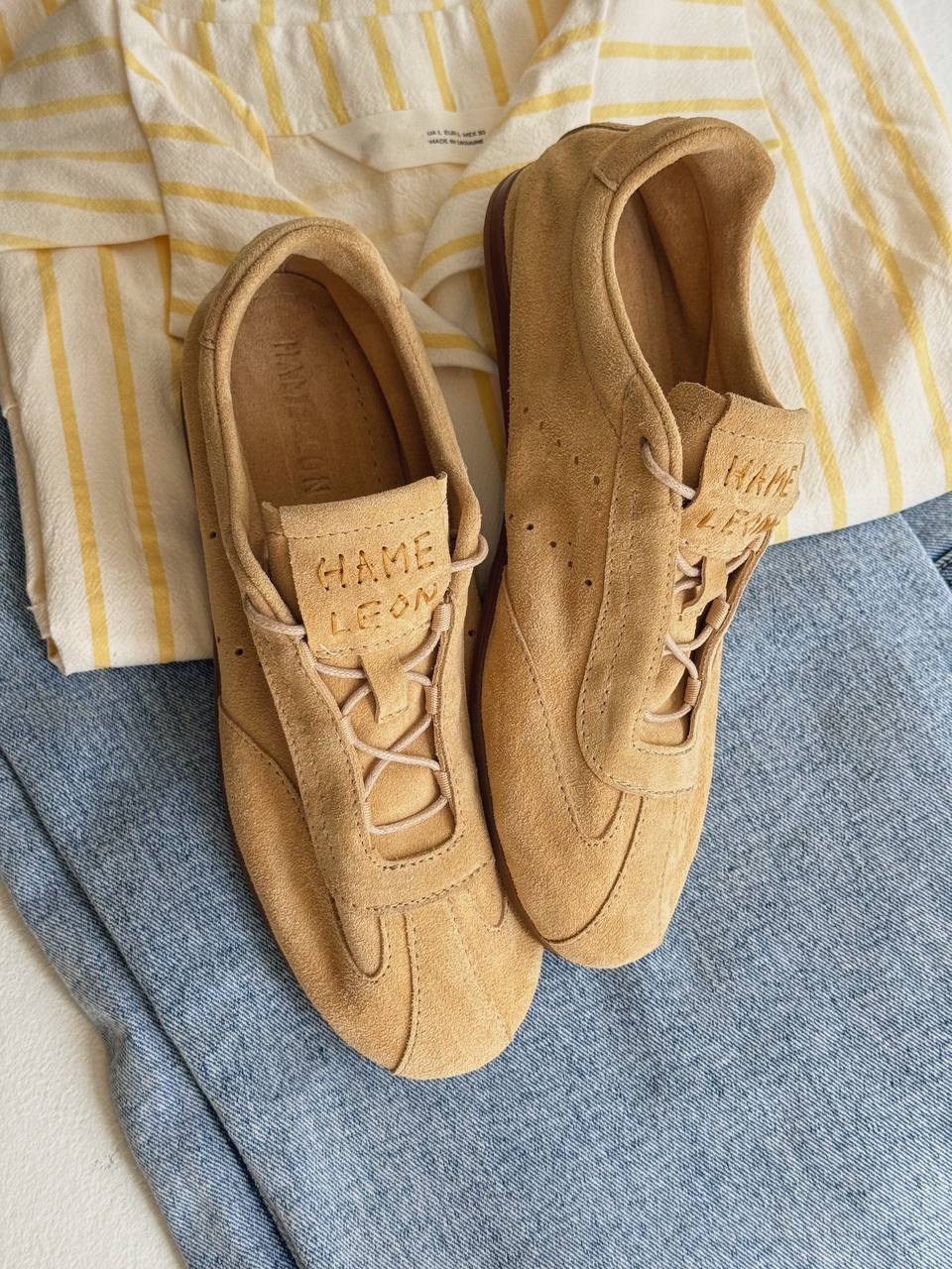 Women wearing Flow Sand suede sneakers
