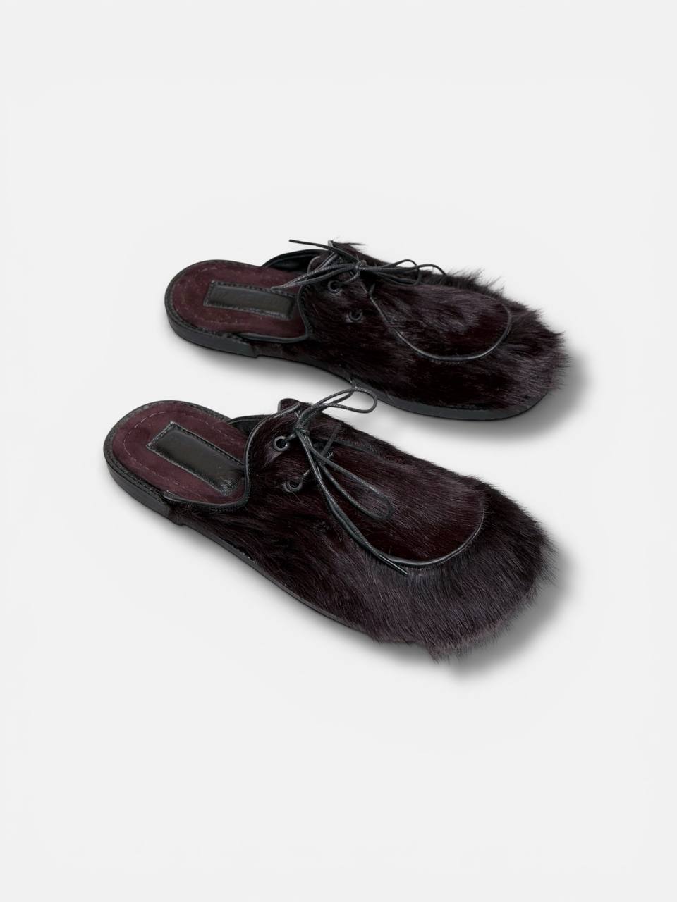 Pair of fur mules women’s handmade shoes editorial composition