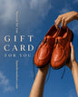 HAMELEON gift card design with handmade orange leather shoes against blue sky