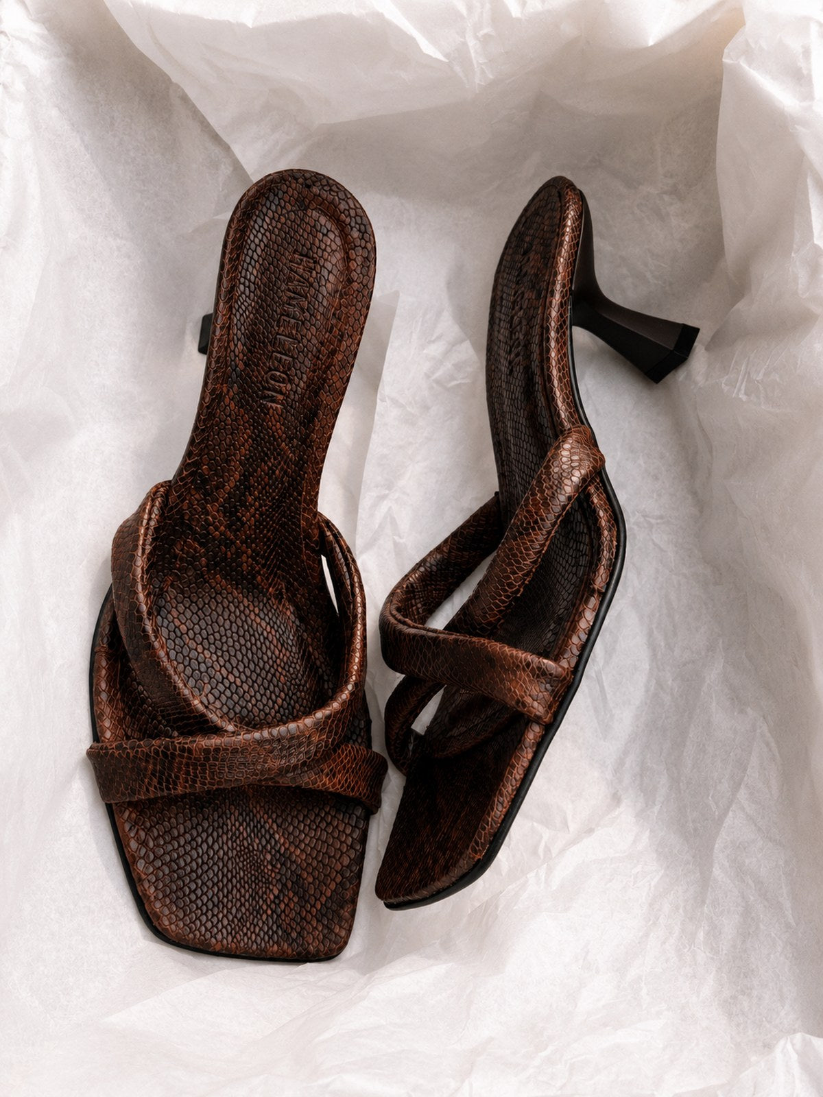 Bronze mule with snakeskin texture, cross straps and square toe