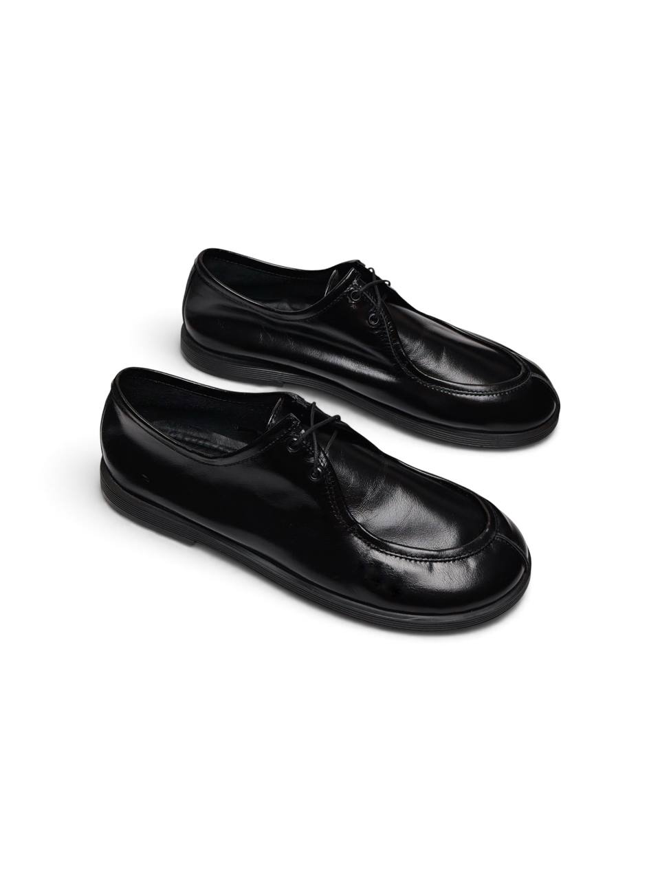Black leather Walker shoes Onyx shown together in a three-quarter view