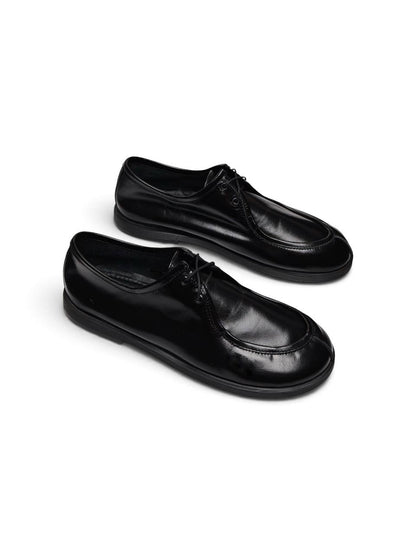 Black leather Walker shoes Onyx shown together in a three-quarter view