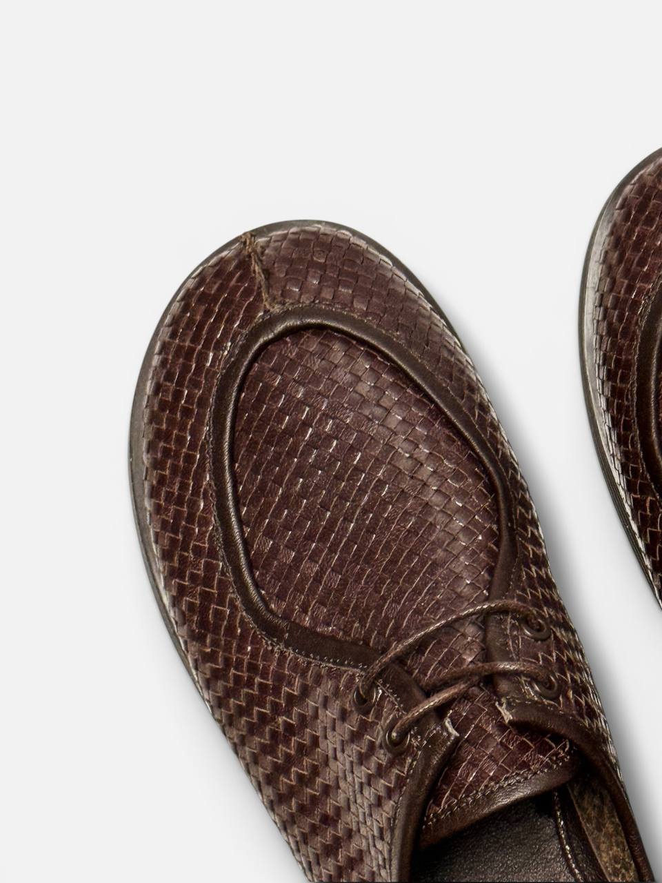 Handwoven Italian leather texture detail brown