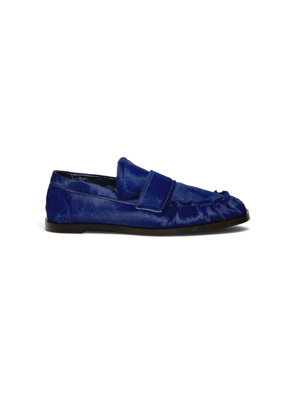 Side profile showing the slim sole and blue leather.