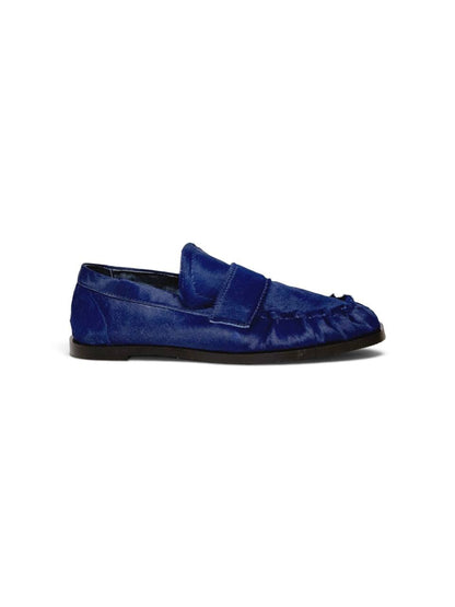 Side profile showing the slim sole and blue leather.