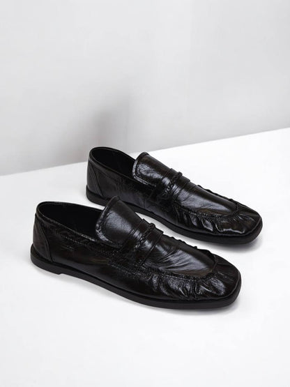 Black patent leather loafers by HAMELEON