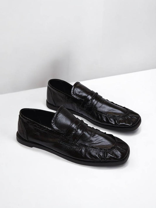 Black patent leather loafers by HAMELEON