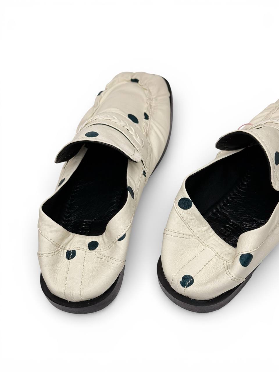 Back view of soft leather loafers with polka dots