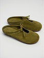 Handmade Mules Lulu Crocus crafted from soft olive suede, featuring a minimalist silhouette, open-back design, and adjustable lace detail