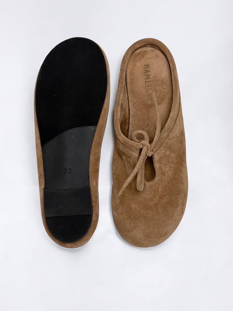 Minimal beige suede mules with soft silhouette