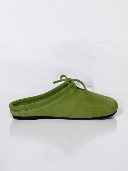 Side view of LULU Moss suede mules with minimalist silhouette